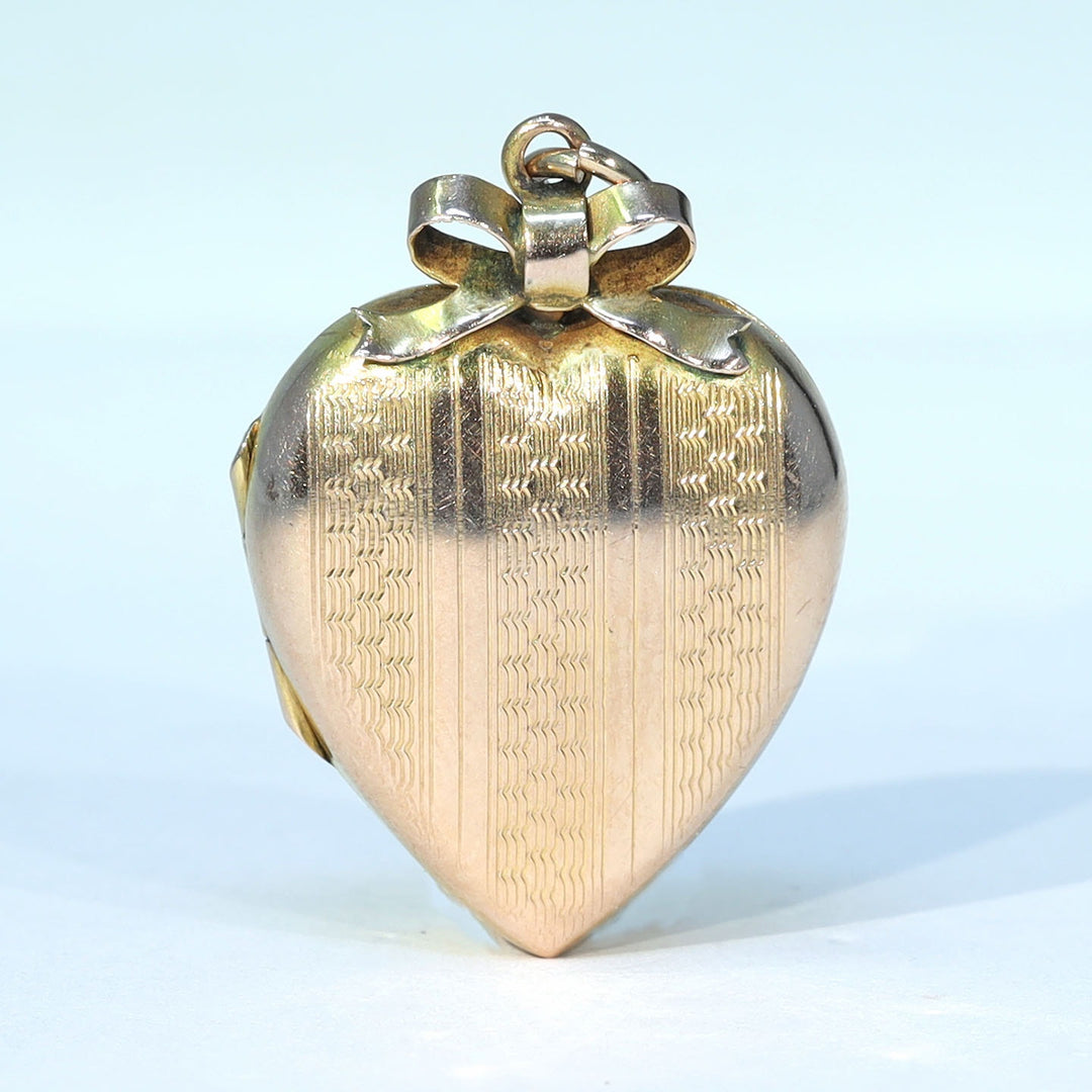 Antique engraved gold heart photo locket