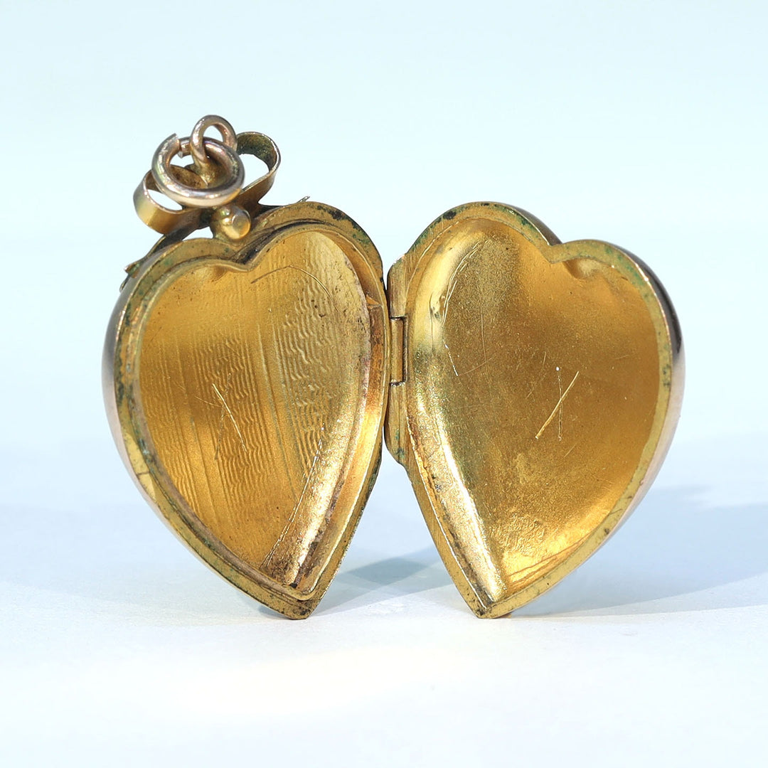 Engraved antique heart locket for photographs