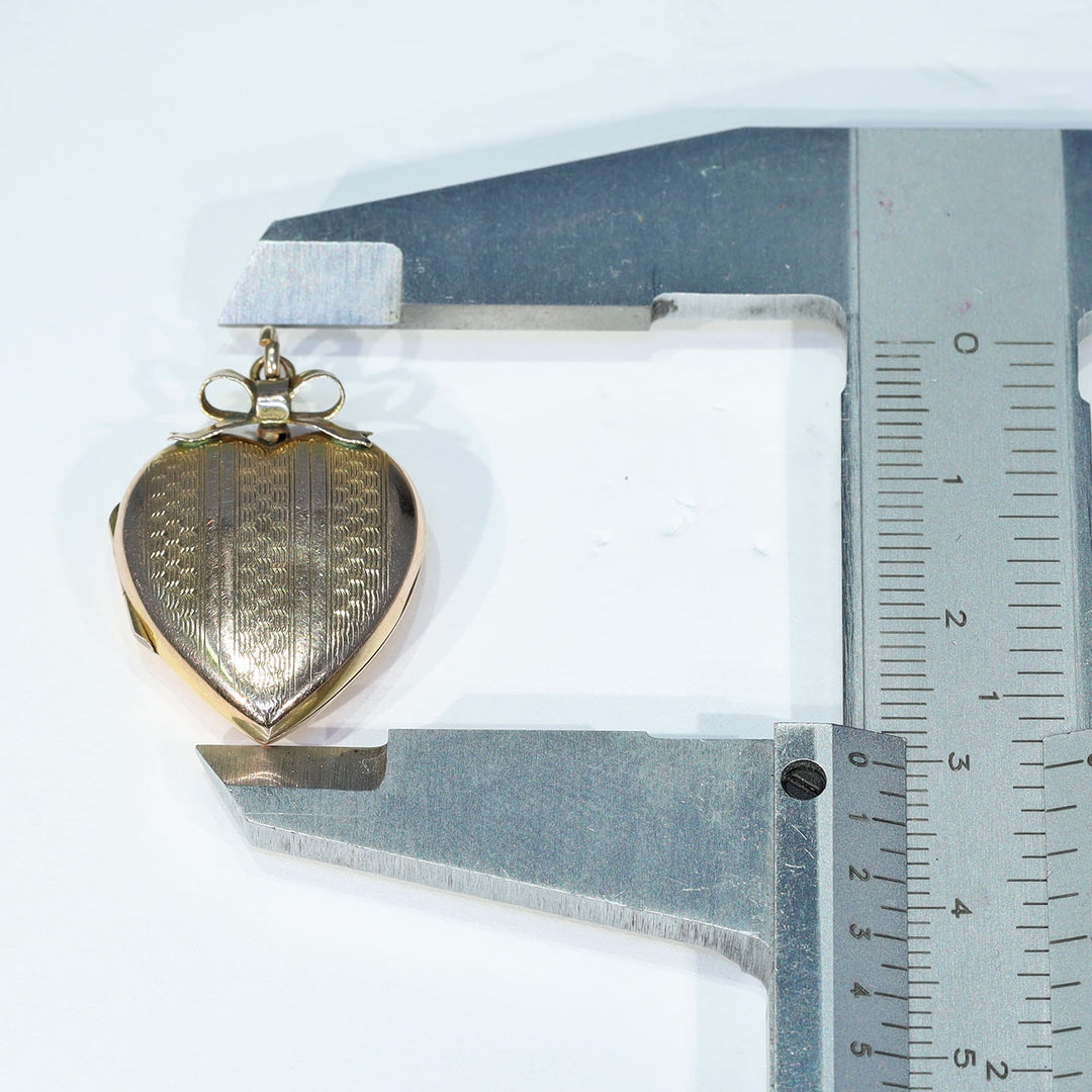 Antique Victorian gold heart bow engraved locket