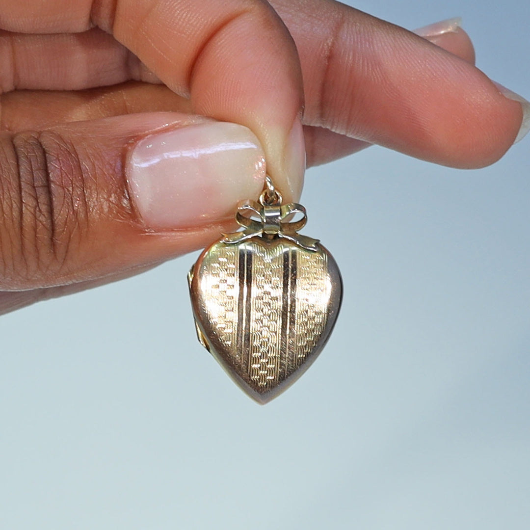 Antique Victorian gold heart bow engraved locket