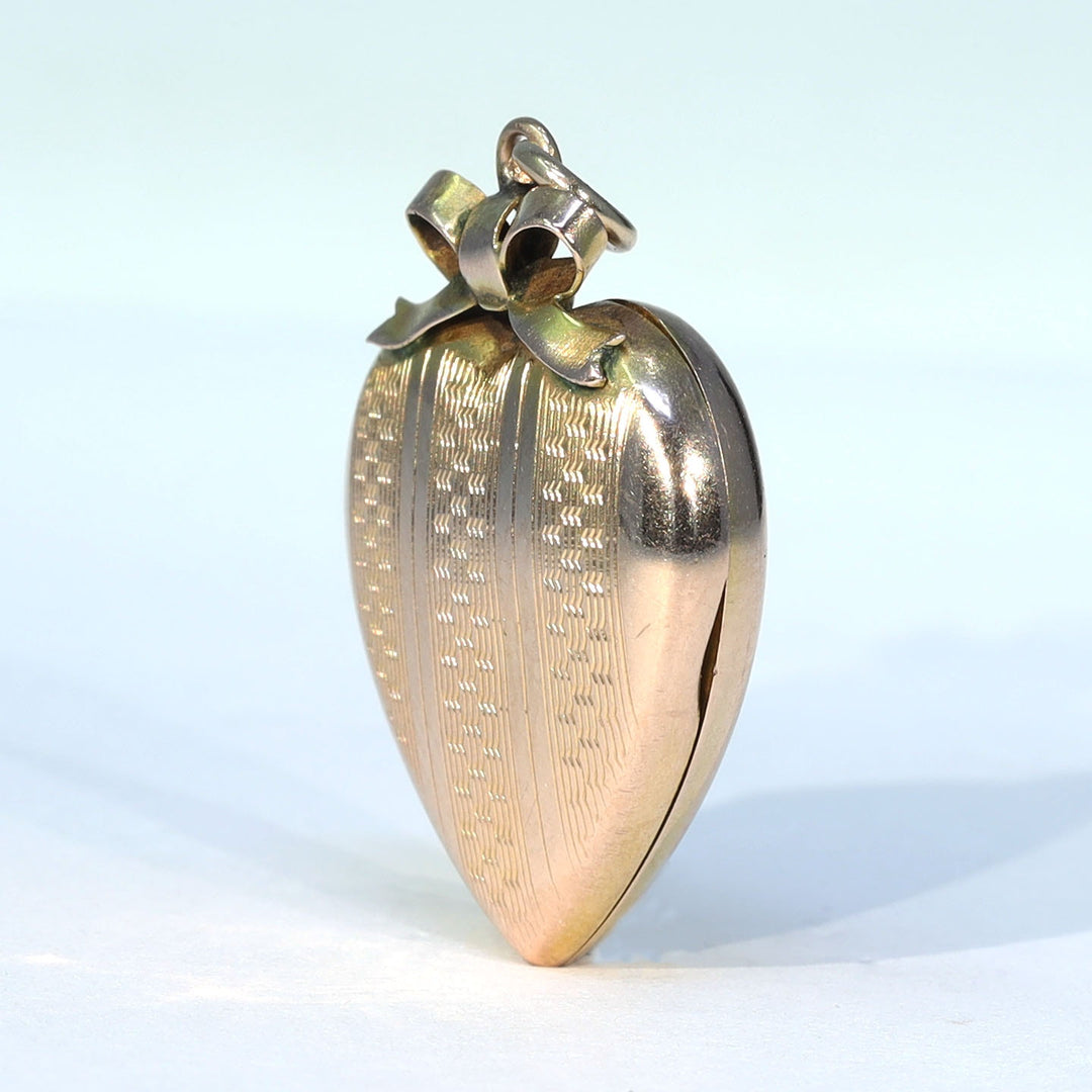 Antique engraved gold heart photo locket