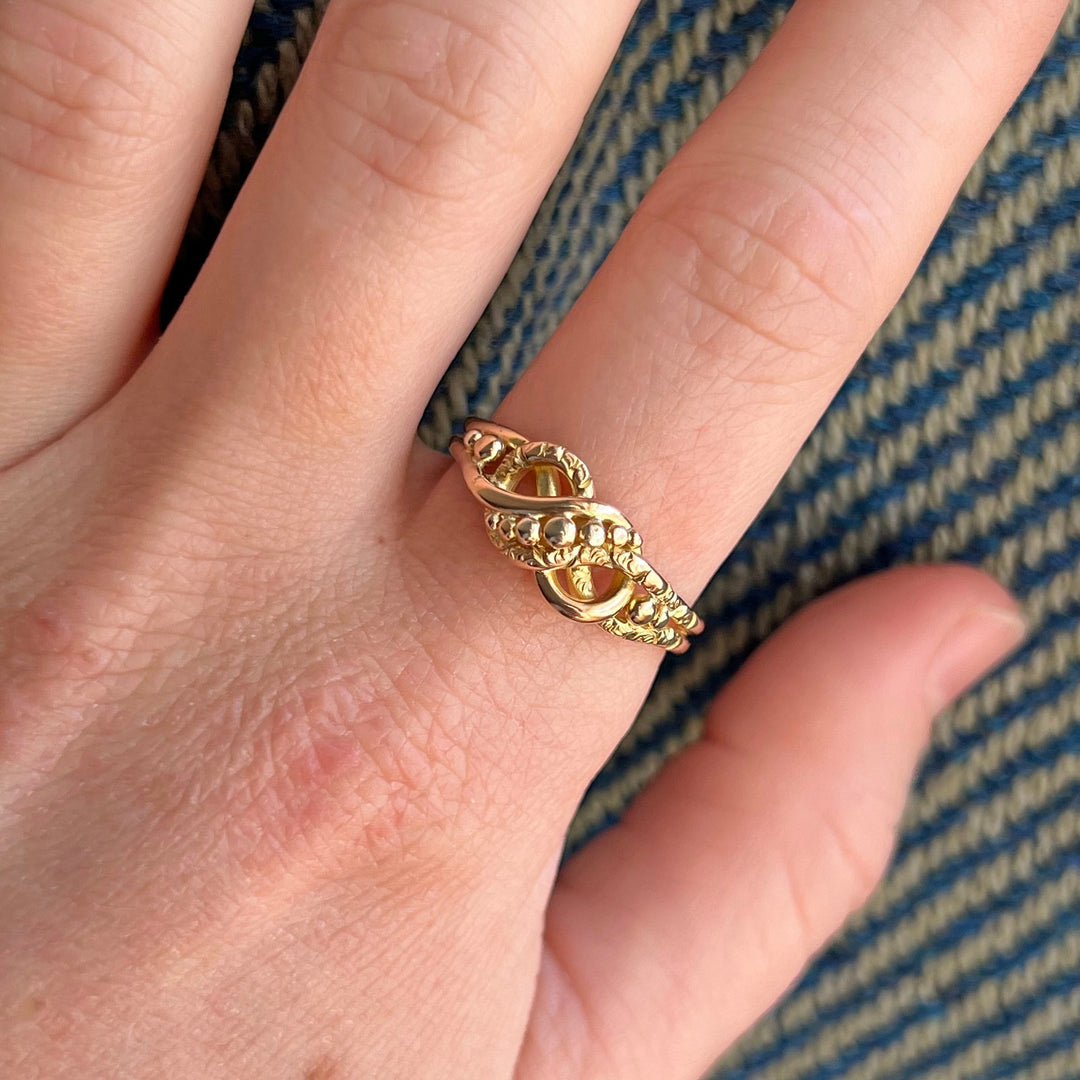 Detailed view of intertwined love knot band