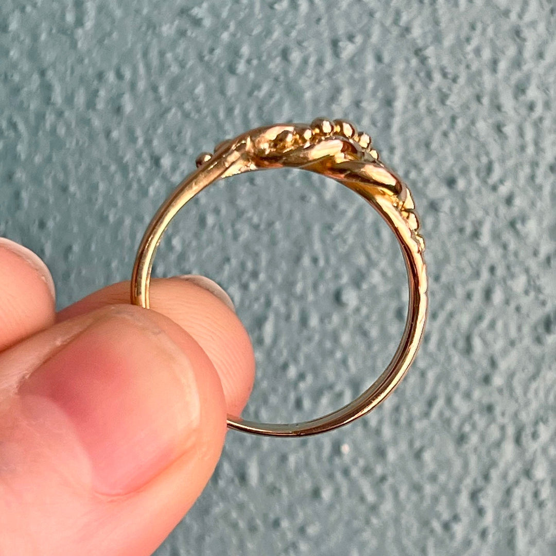 Side profile of antique gold knot ring