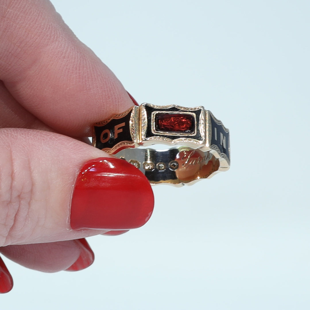 Victorian black enamel and garnet memorial ring dated 1869