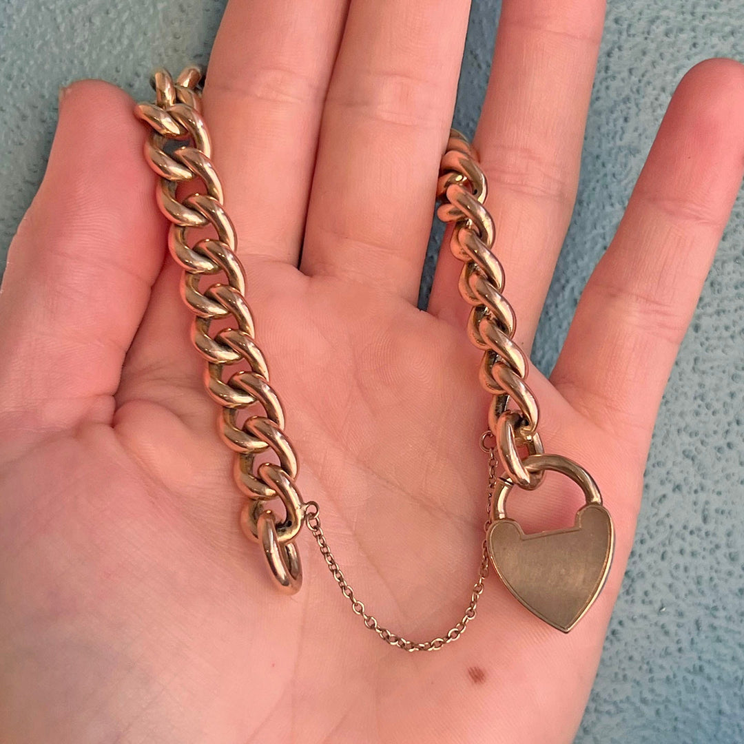 Detail of heart padlock clasp antique gold bracelet