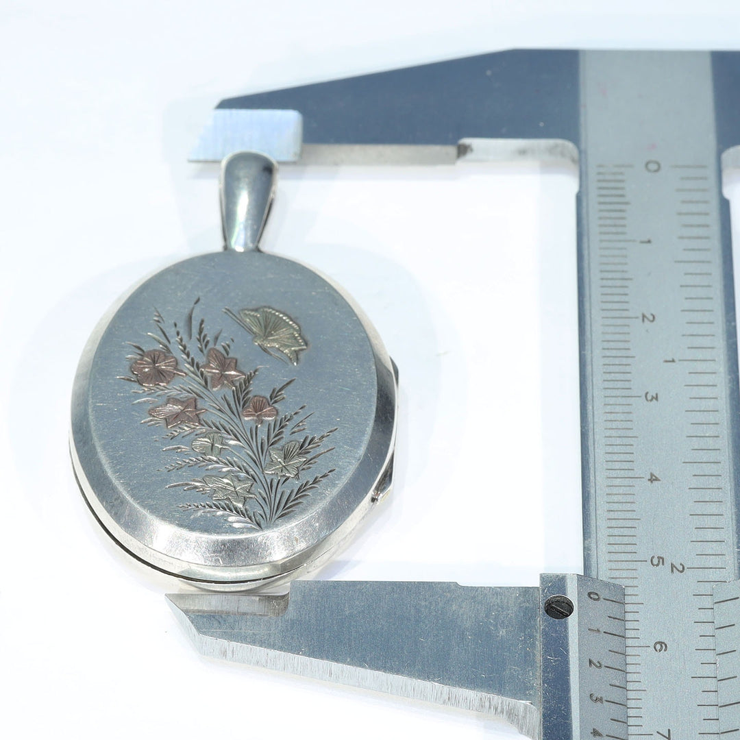 Victorian butterfly jewelry in engraved silver
