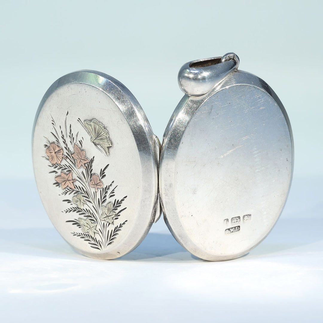 Antique engraved silver butterfly photo locket