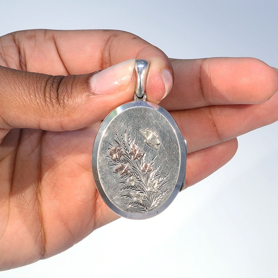 Collectible Victorian floral and butterfly locket
