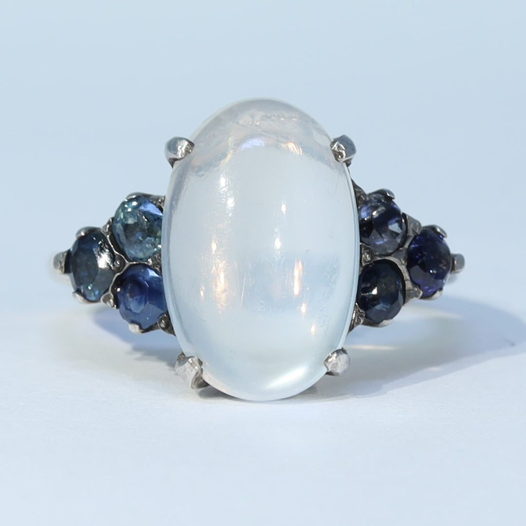 Vintage moonstone ring with six blue sapphires