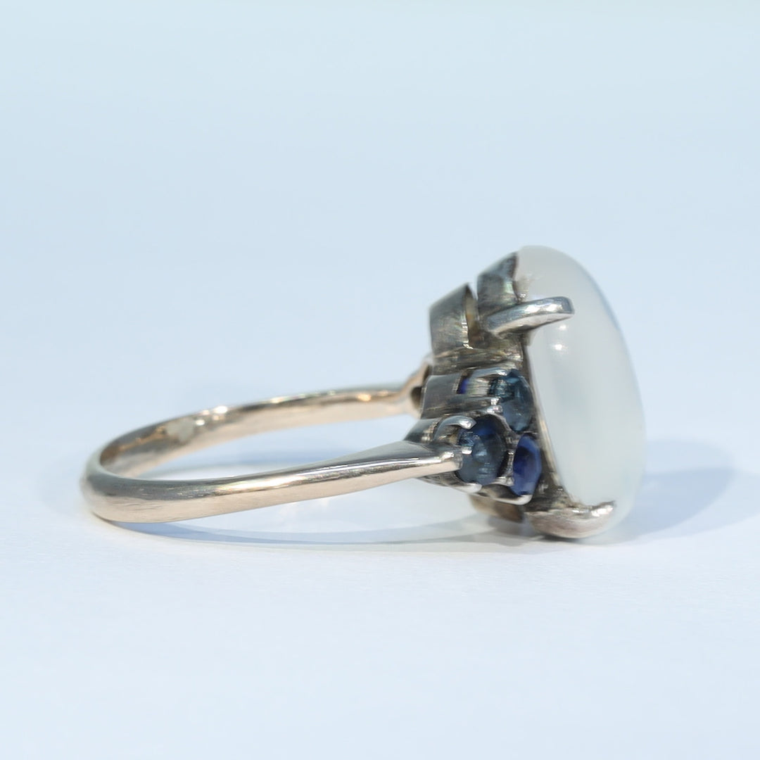 Vintage moonstone ring with six blue sapphires