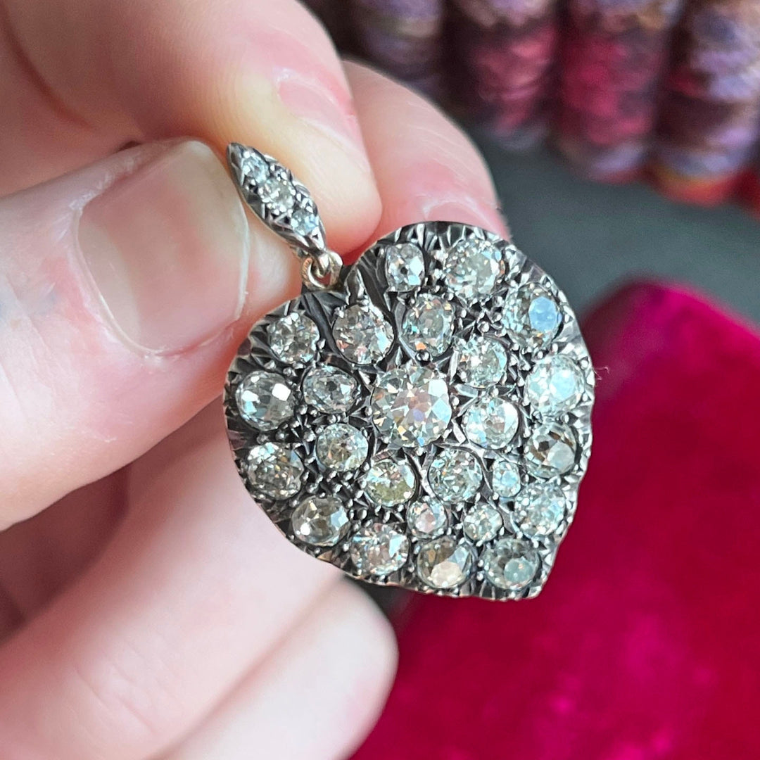 Close view of diamond heart pendant in gold