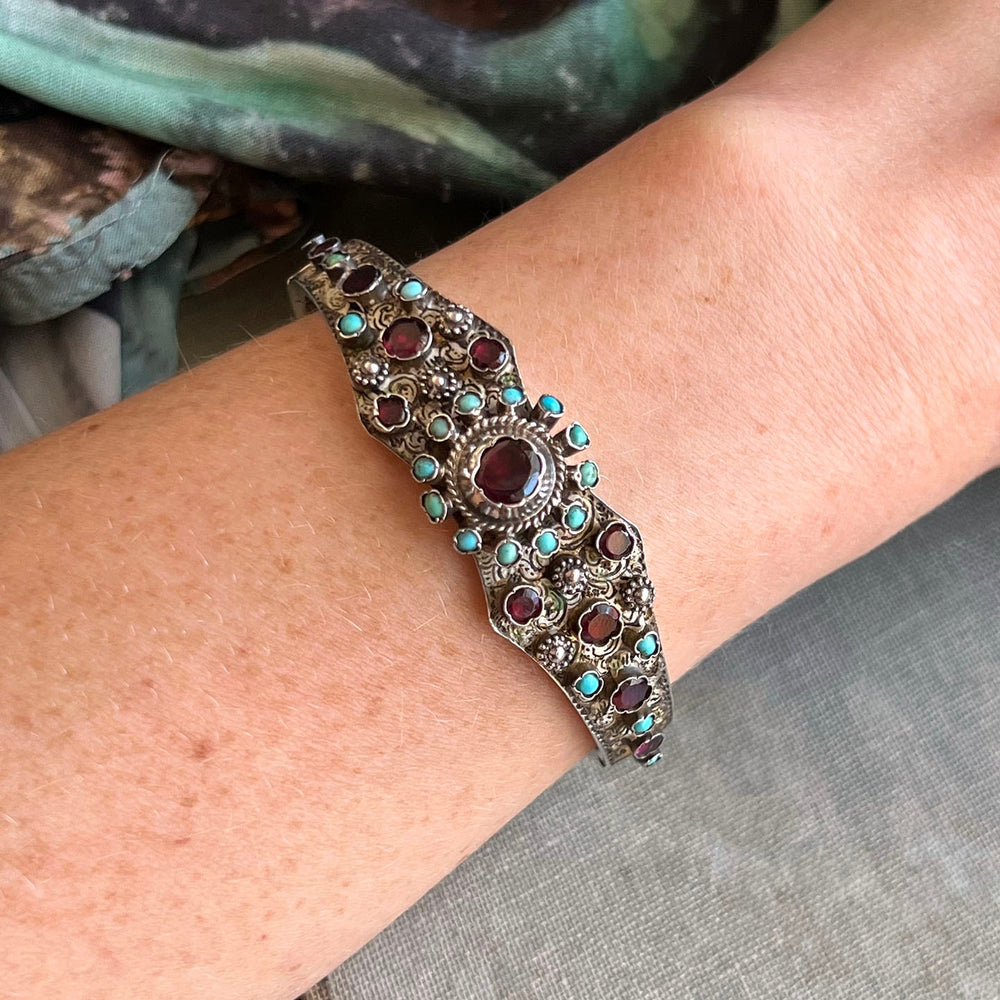 Vintage turquoise garnet bracelet worn on wrist