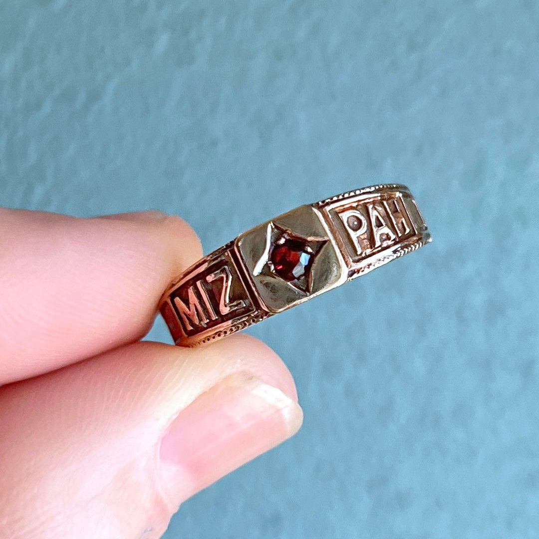 Estate Mizpah ring with red garnet and gold