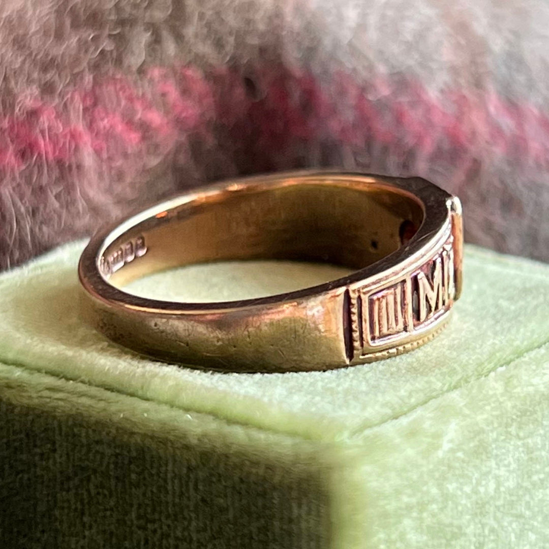 Mizpah garnet gold ring close up