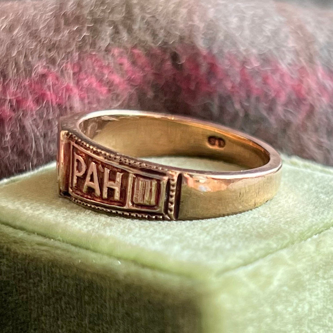 Close up vintage gold garnet Mizpah ring