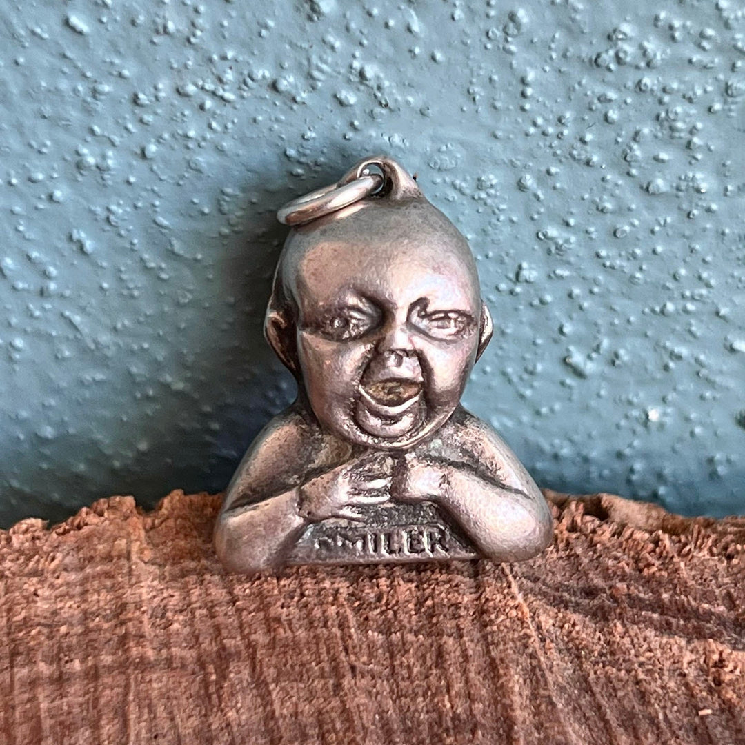 Vintage sterling silver Cow & Gate Baby Smiler charm