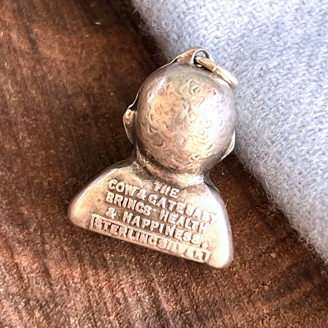 Vintage Cow & Gate collectible charm