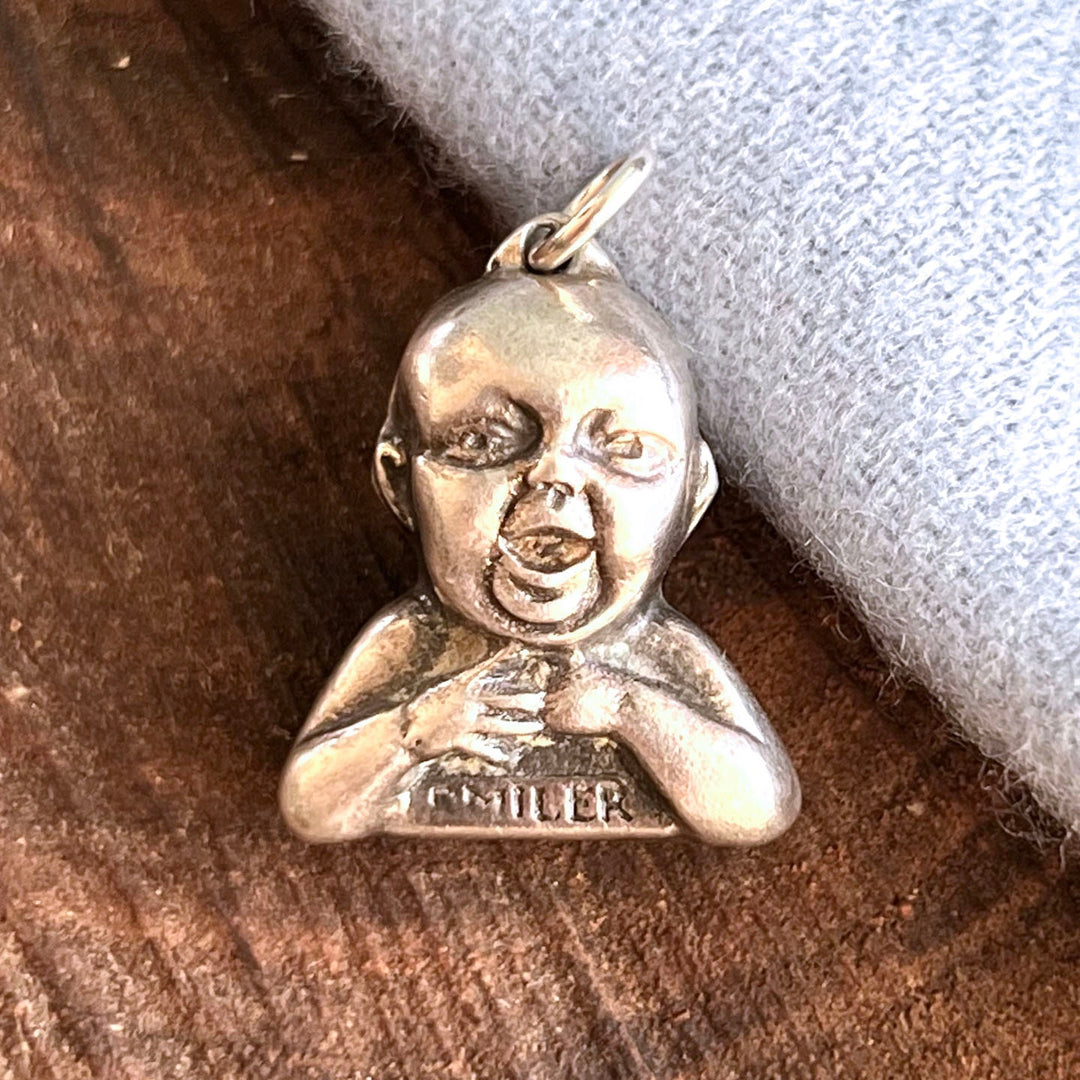 Sterling silver baby advertising charm